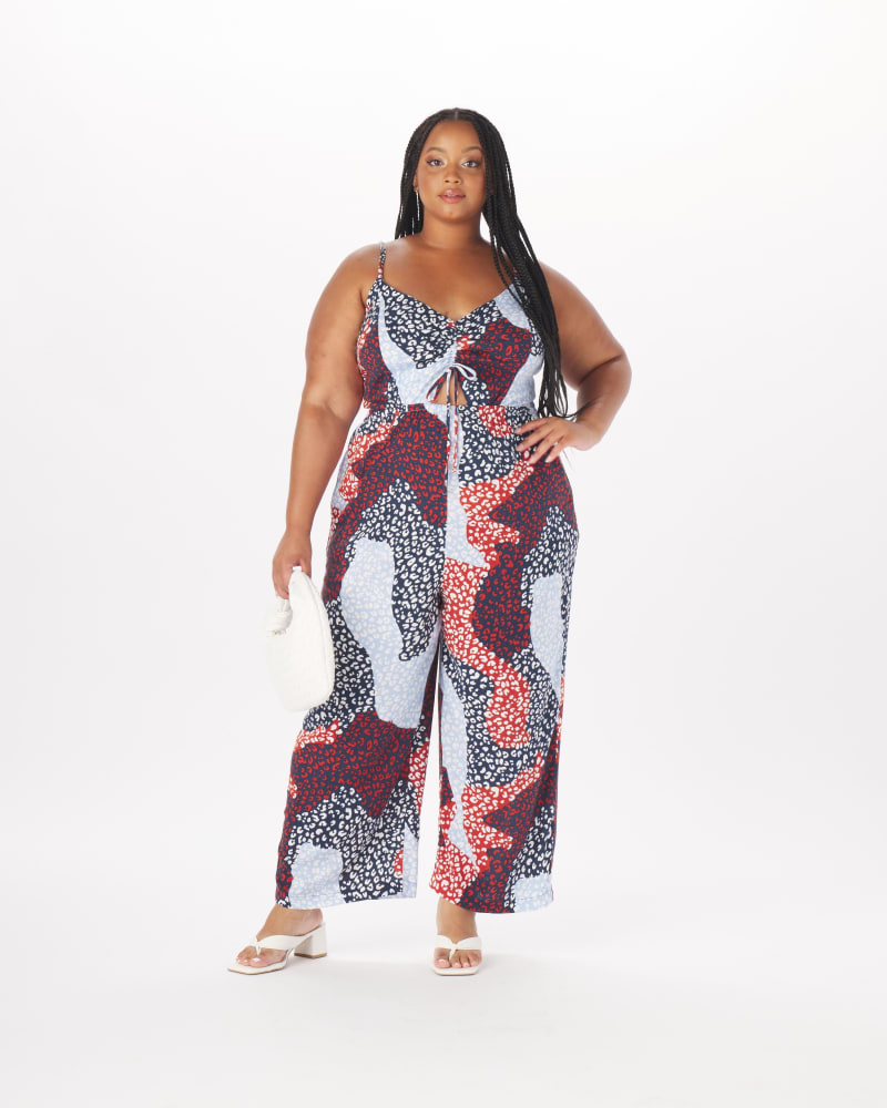 Front of a model wearing a size 3X Benny Keyhole Jumpsuit in Multi Animal in Cornflower Blue by What Lo Wants. | dia_product_style_image_id:237922